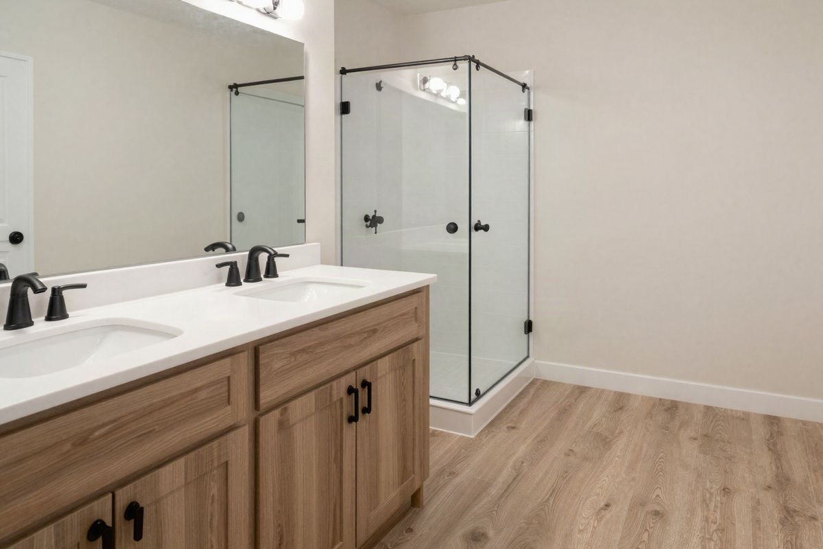Primary bathroom with a double vanity and walk-in shower