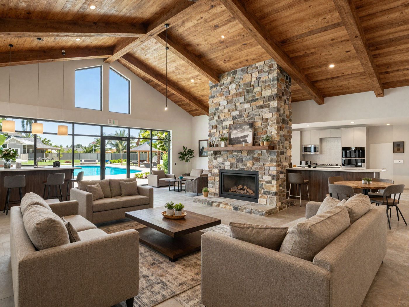 The clubhouse lounge with a stone fireplace, seating and a coffee bar