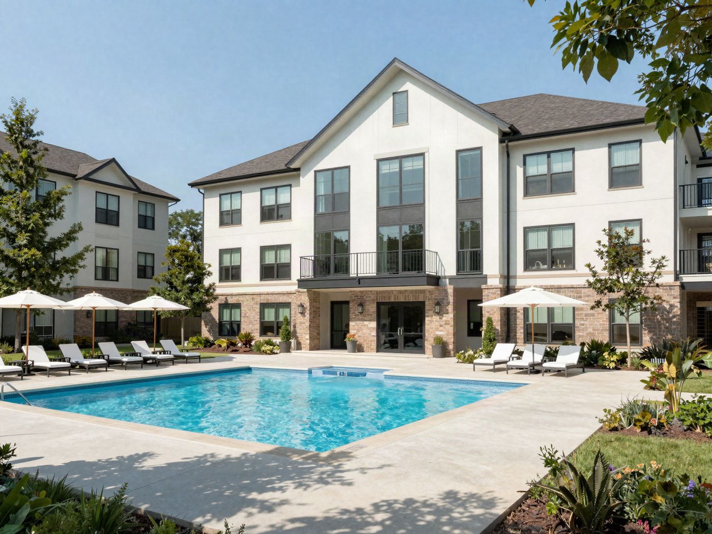 The clubhouse and the pool with its sundeck, lounge chairs and cabanas
